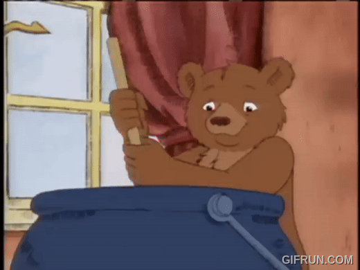 The children’s book character Little Bear, an anthropomorphic bear, is stirring a big blue pot of soup.