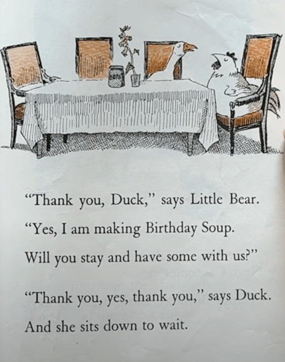 An illustration from the children’s book <em>Little Bear</em> (1957) showing a duck and a hen sitting upright in chairs at a dining table covered with a fringed tablecloth. There is a potted flower and a jar in the center of the table. The accompanying text reads: “Thank you, Duck,” says Little Bear.  “Yes, I am making Birthday Soup. Will you stay and have some with us?” “Thank you, yes, thank you,” says Duck. And she sits down to wait.