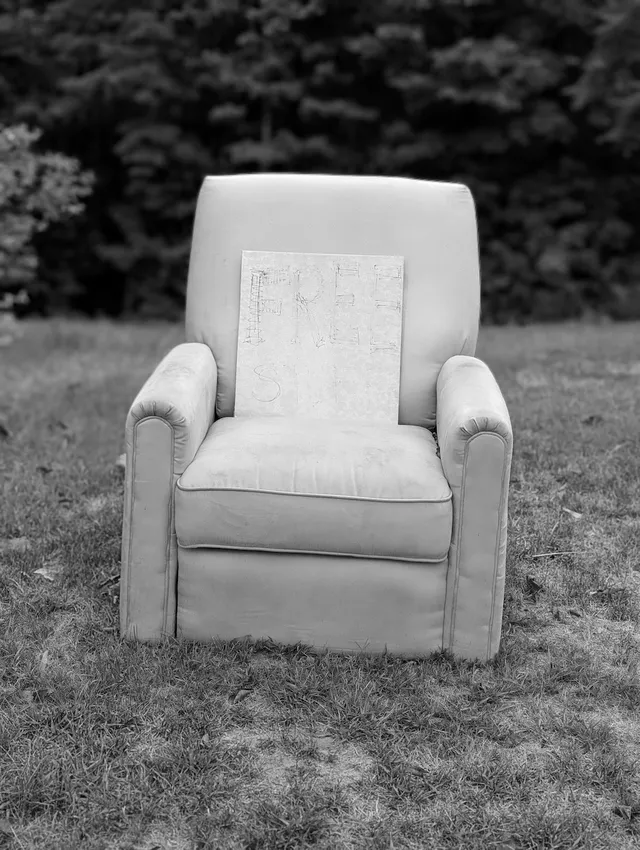 photograph of free chair on side of road