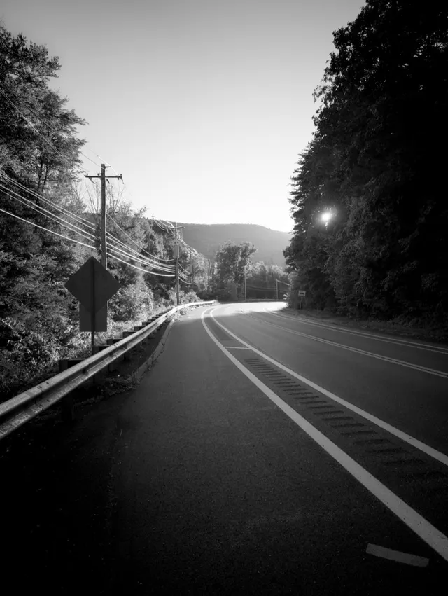 photograph of sunet on an empty road
