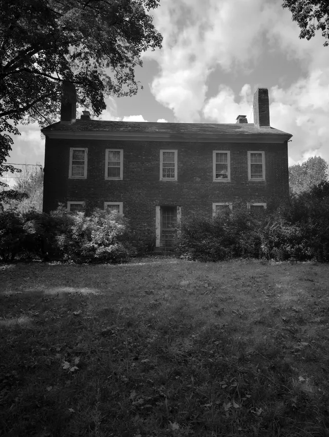 photograph of an old brick house