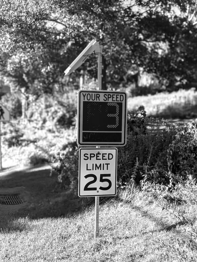photograph of speed limit sign with the speed of 3 shown