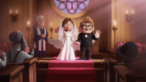Carl and Ellie from Pixar’s Up, waving out at the crowd as they get married