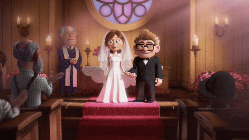 Carl and Ellie from Pixar’s Up, waving out at the crowd as they get married